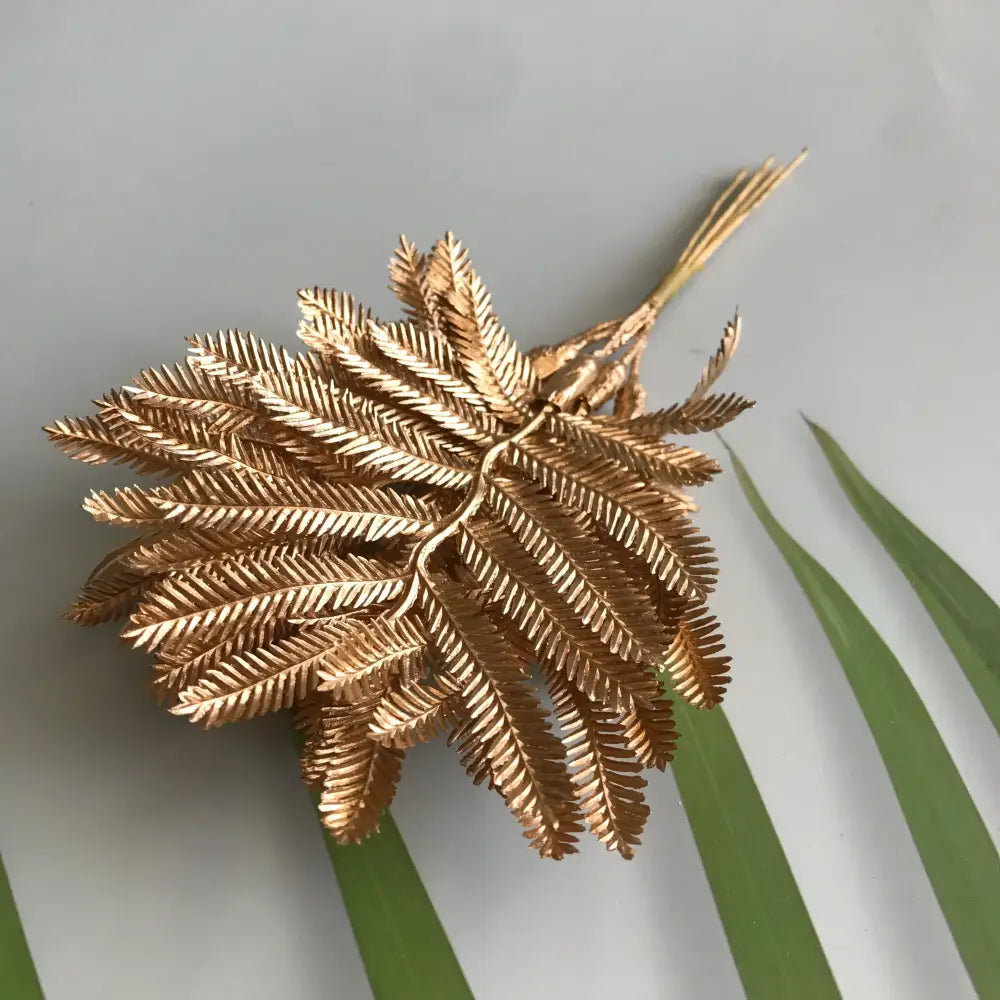 Gold-colored metallic fern brooch with intricate leaf detailing for decorbites green plant berry stamen decor