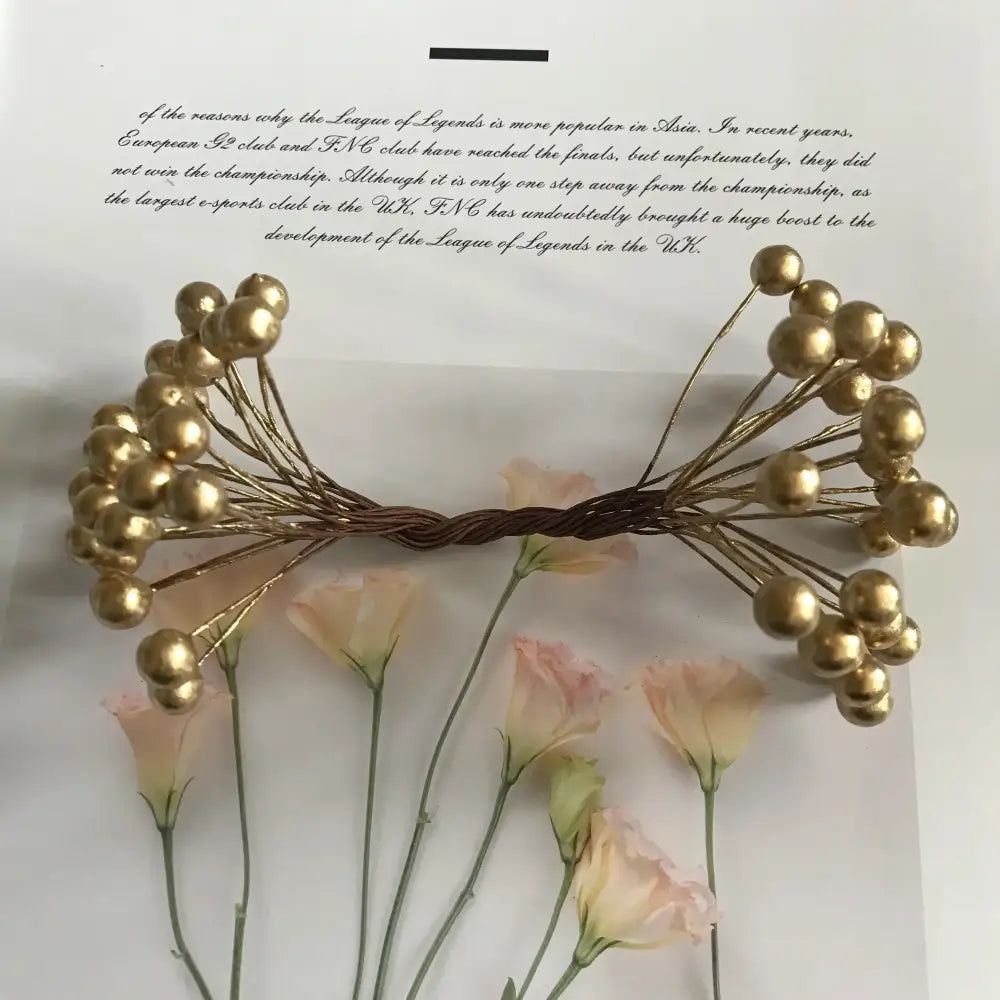 Golden metallic berry stamen hair accessory with twisted wire stems for decorbites green plant living room decor