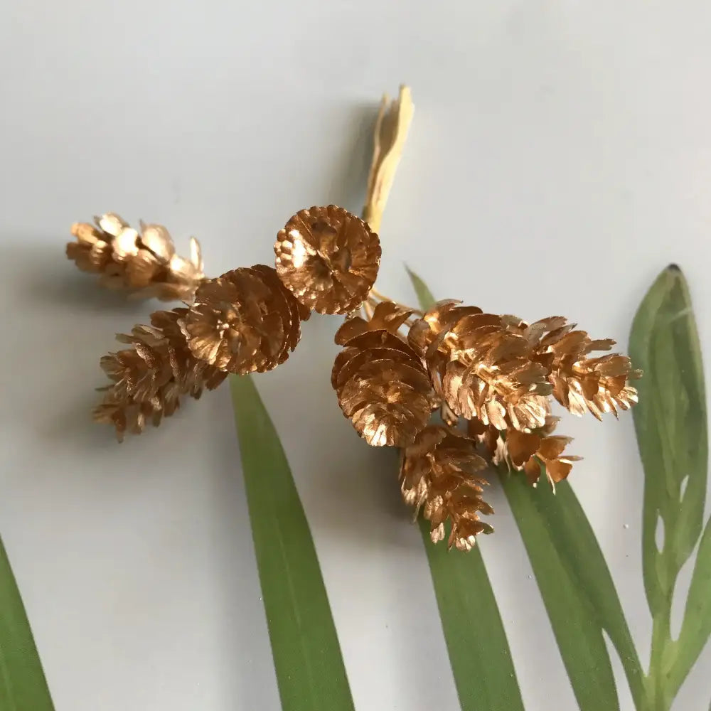 Golden metallic pinecone cluster brooch with intricate detailing for decorbites green plant berry stamen decor