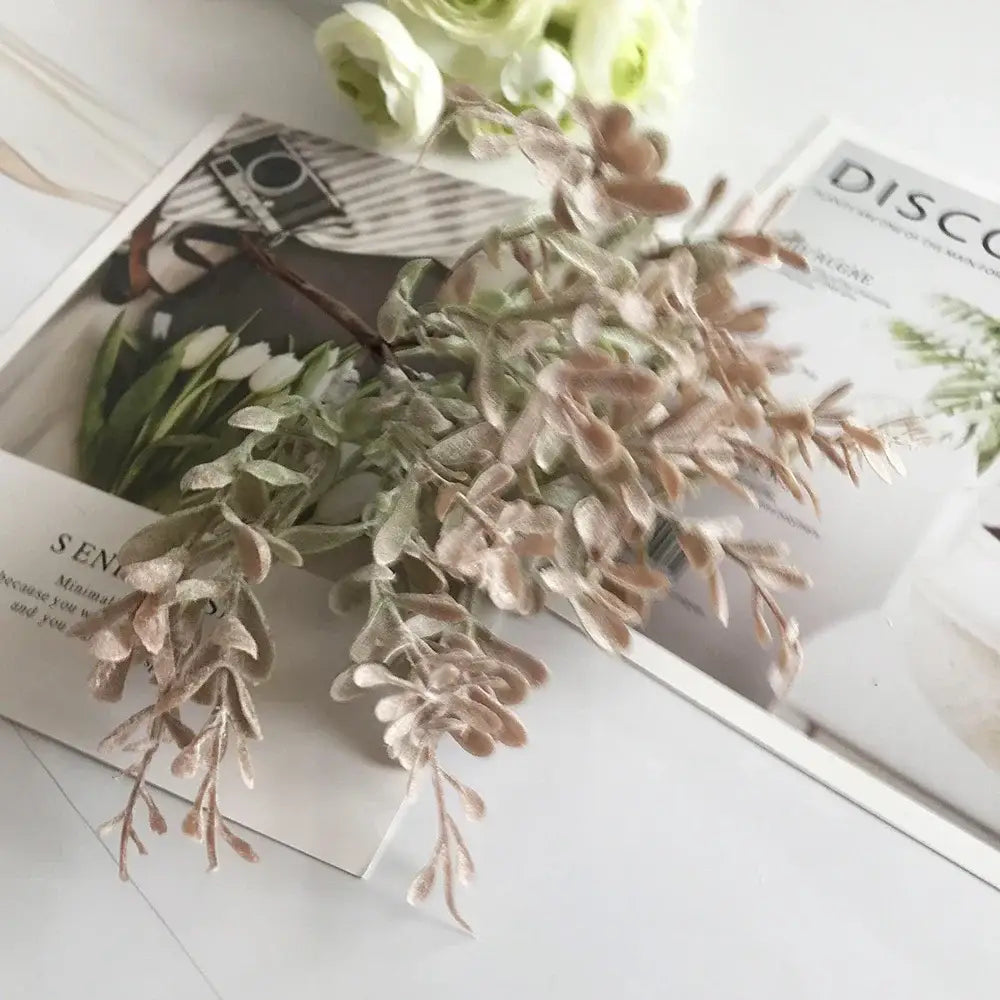 A delicate golden metallic berry stamen green plant foliage with velvety beige and muted green leaves for decorbites decor