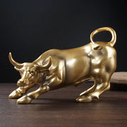 Golden metallic bull figurine with polished reflective surface and detailed musculature perfect for living room feng shui decorbites bull figurine