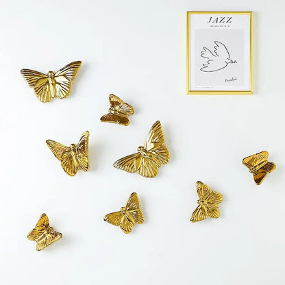 Golden metallic ceramic butterfly wall decoration set with detailed wing patterns for living room wall decor