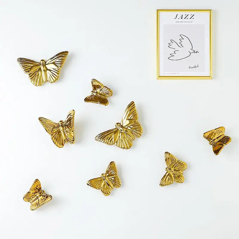Golden metallic ceramic butterfly wall decoration set with detailed wing patterns for living room wall decor