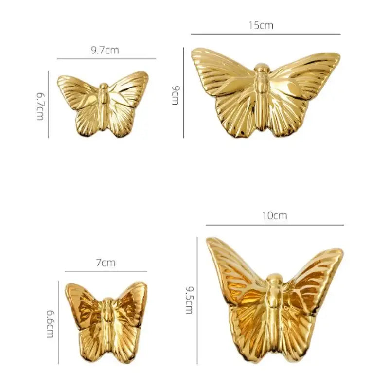Gold-colored butterfly-shaped metallic pins with detailed wings in a golden metallic butterfly wall decoration set for living room