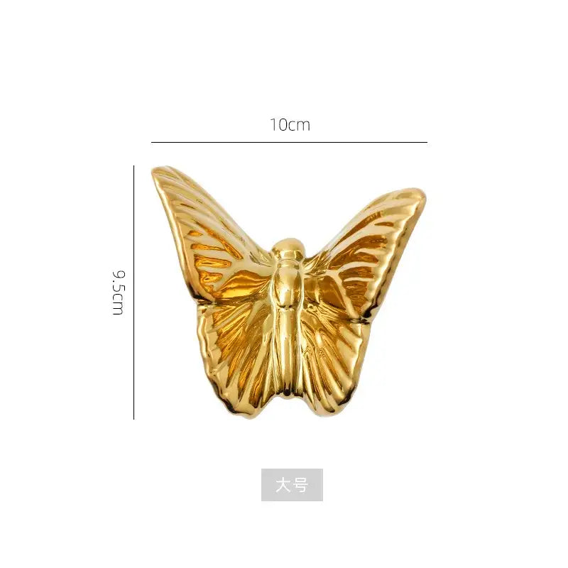 Golden metallic butterfly wall decoration set featuring a glossy finish and detailed wing veins, 10cm wide 9.5cm tall