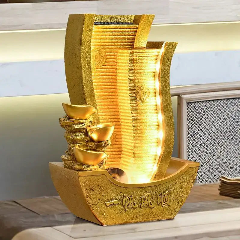 Golden metallic circulating water fountain shaped like a boat with stacked gold ingots and engraved Chinese characters for living room decorbites circulating water wealth decor