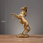 Golden metallic horse resin sculpture with detailed mane and tail on rocky base for living room decorbites horse decor