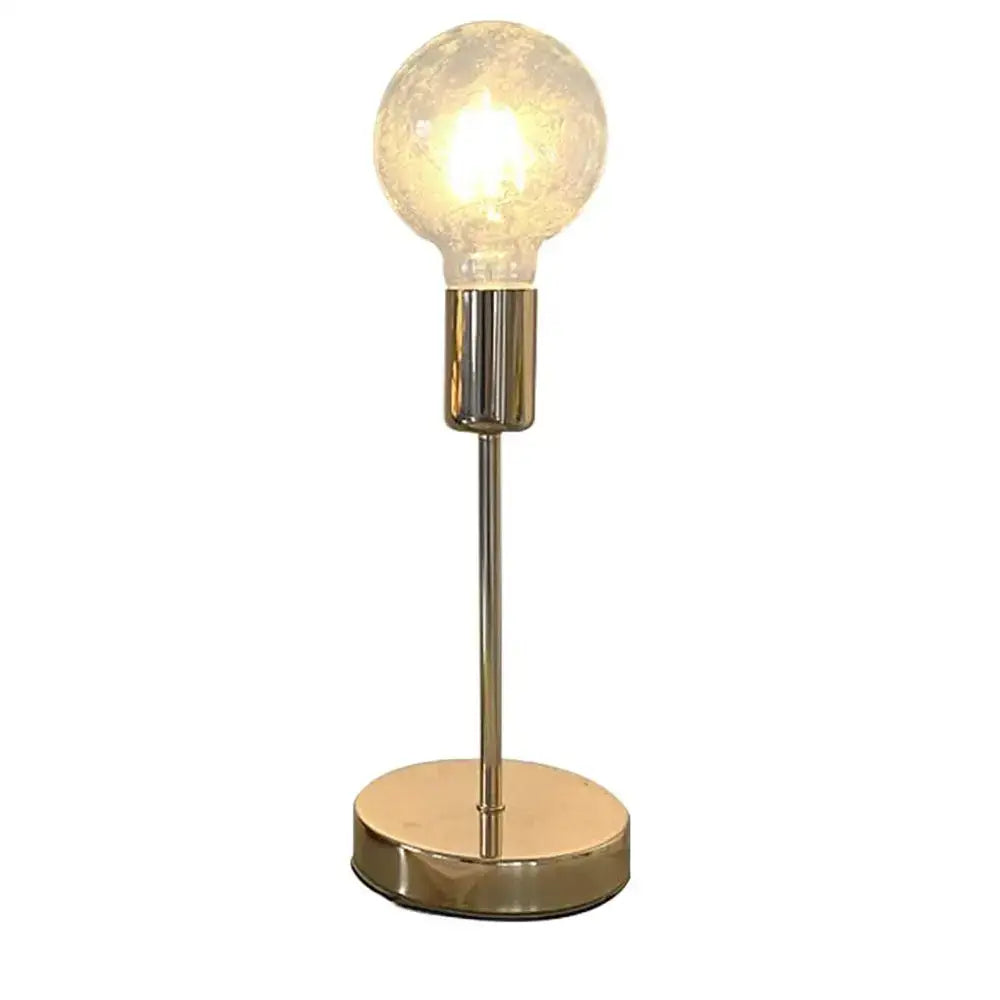 A decorbites golden modern led desk lamp features a warm glowing textured glass bulb with brass finish and minimalist design