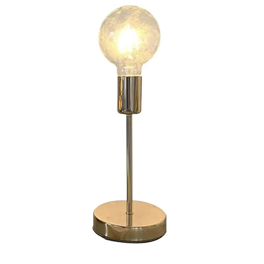 A decorbites golden modern led desk lamp features a warm glowing textured glass bulb with brass finish and minimalist design