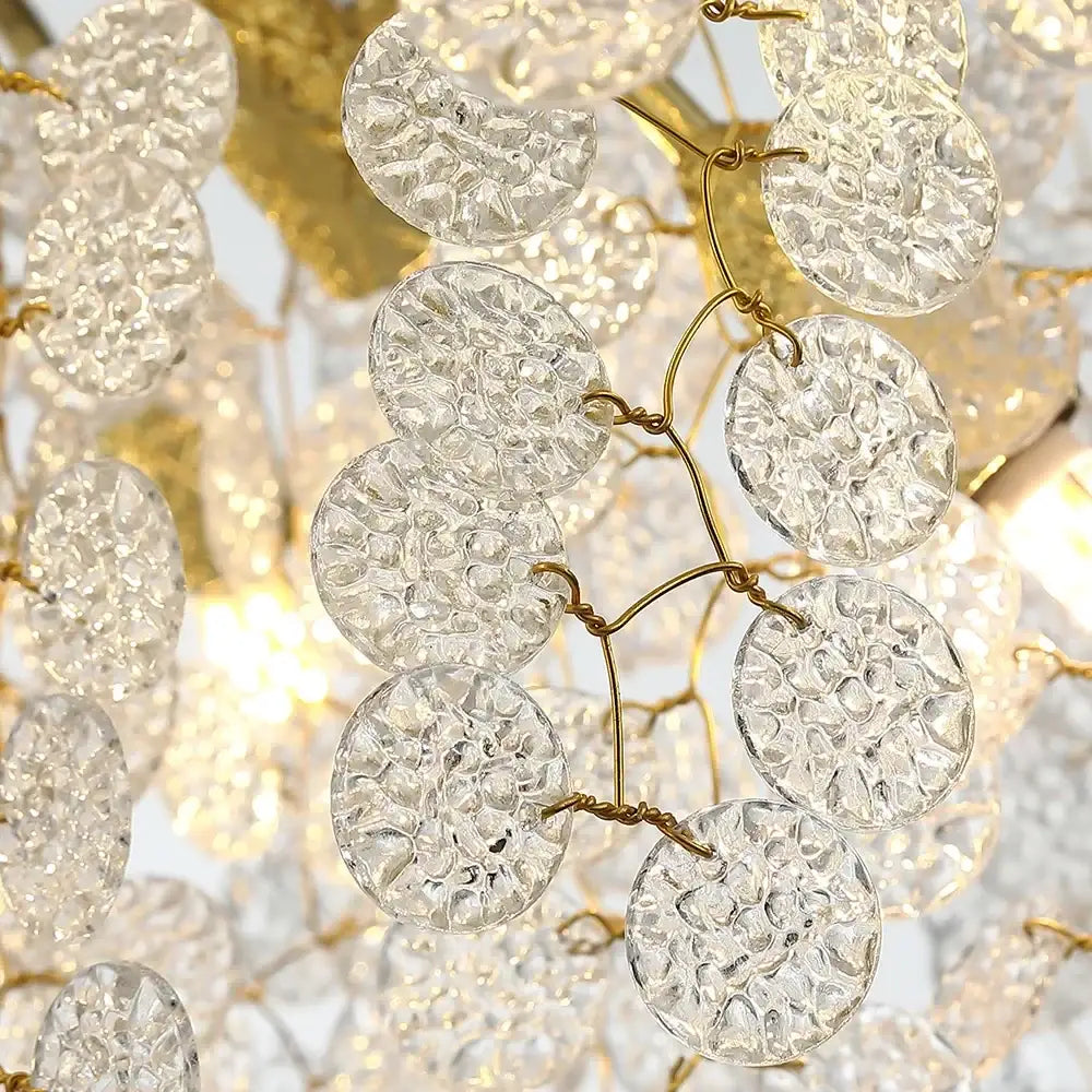 Clear textured glass discs hang from delicate gold wirework in golden money tree crystal chandelier pendant light