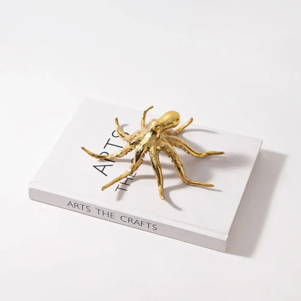 Golden octopus metal sculpture with detailed articulated limbs and polished finish for living room decorbites decor