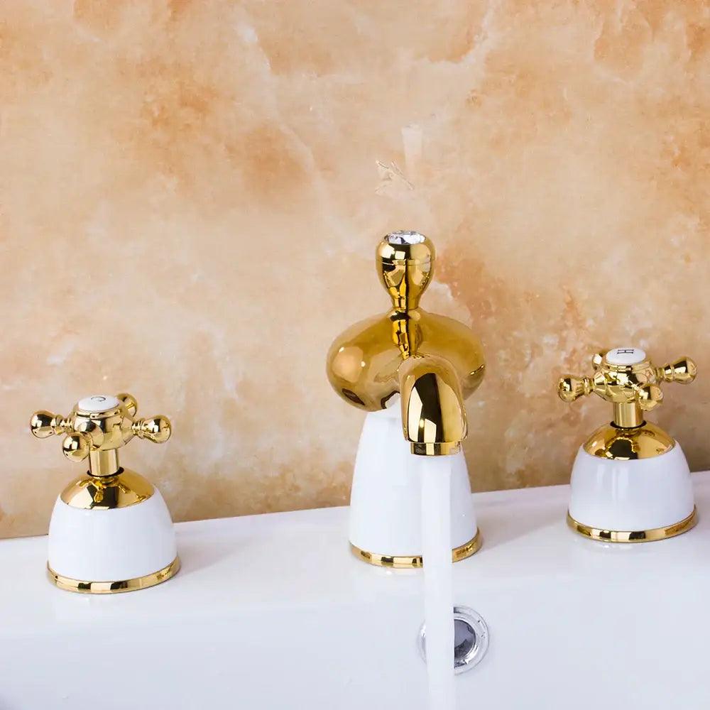 Golden plated bathroom faucet set with white ceramic cross-handle controls by decorbites for elegant decor
