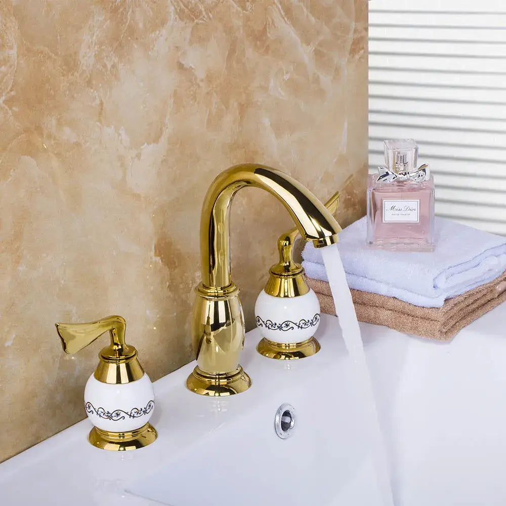 Golden plated bathroom faucet set with white ceramic handles and black ornate detailing by decorbites golden plated