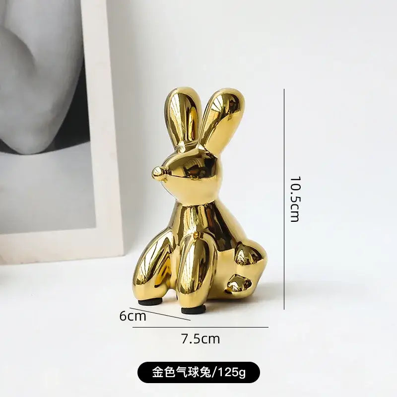 Golden porcelain balloon animal desk ornament with glossy metallic finish suitable for living room decorbites golden monkey