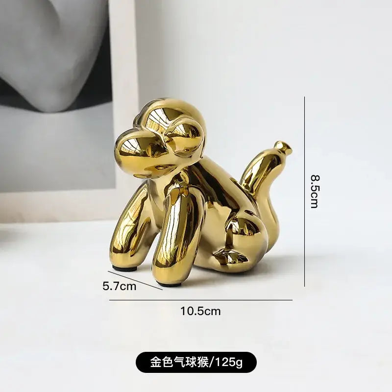 Golden porcelain balloon dog desk ornament with glossy metallic finish ideal for decorbites golden monkey decor