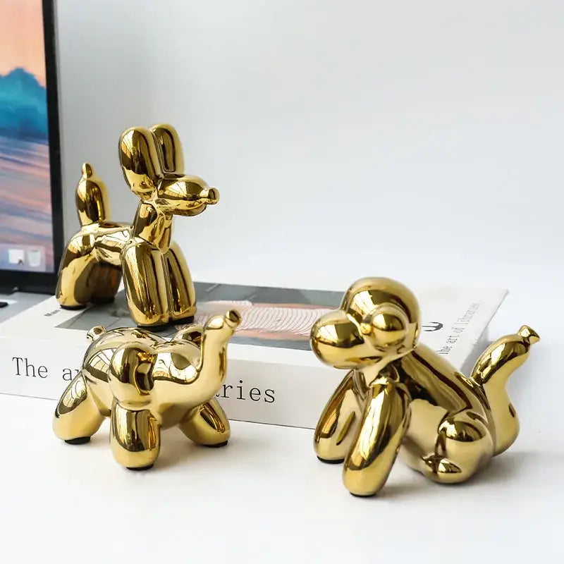 Shiny golden porcelain balloon dog desk ornament with glossy finish and stylized form for living room decorbites golden monkey