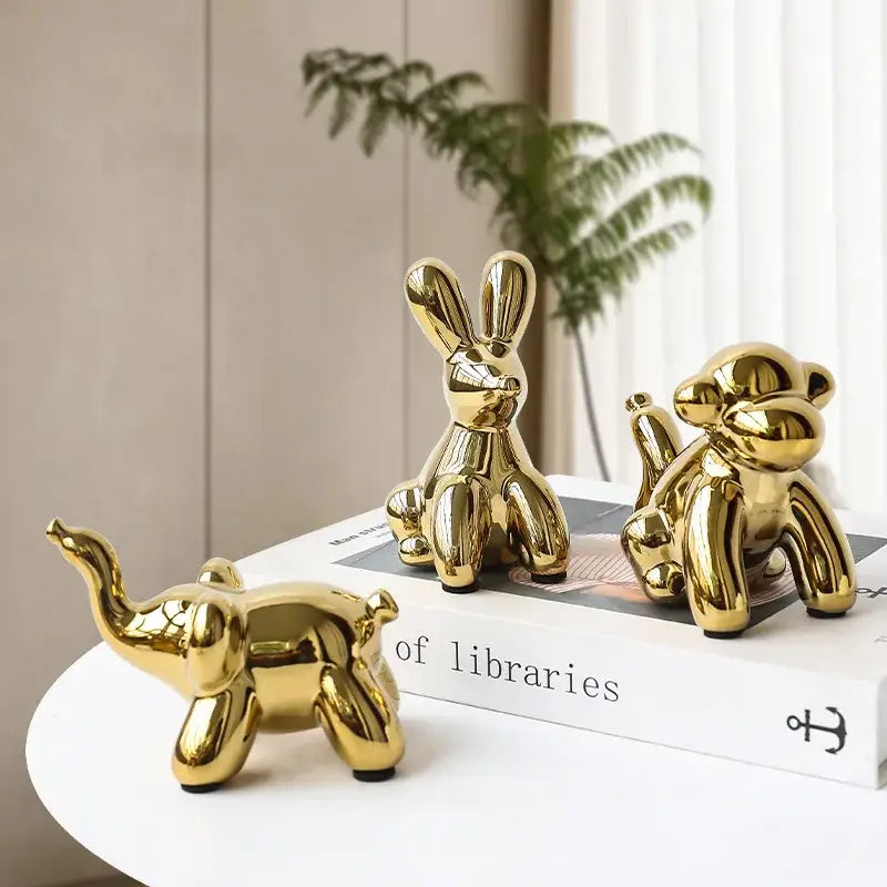 Shiny golden porcelain balloon animal desk ornament set featuring an elephant rabbit and decorbites golden monkey for living room decor