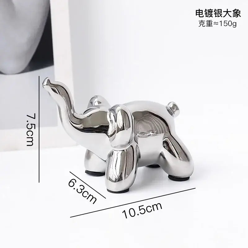 Shiny silver-plated elephant figurine with modern design and rounded contours desk ornament by decorbites golden monkey