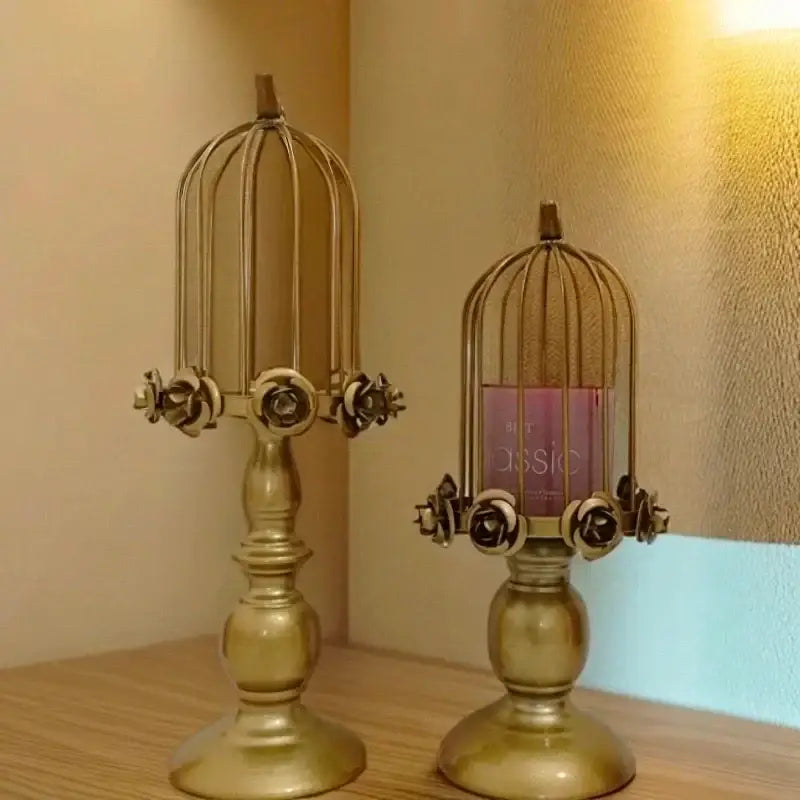 Golden metal birdcage style ornament candle holder with rose embellishments for elegant dining room decor