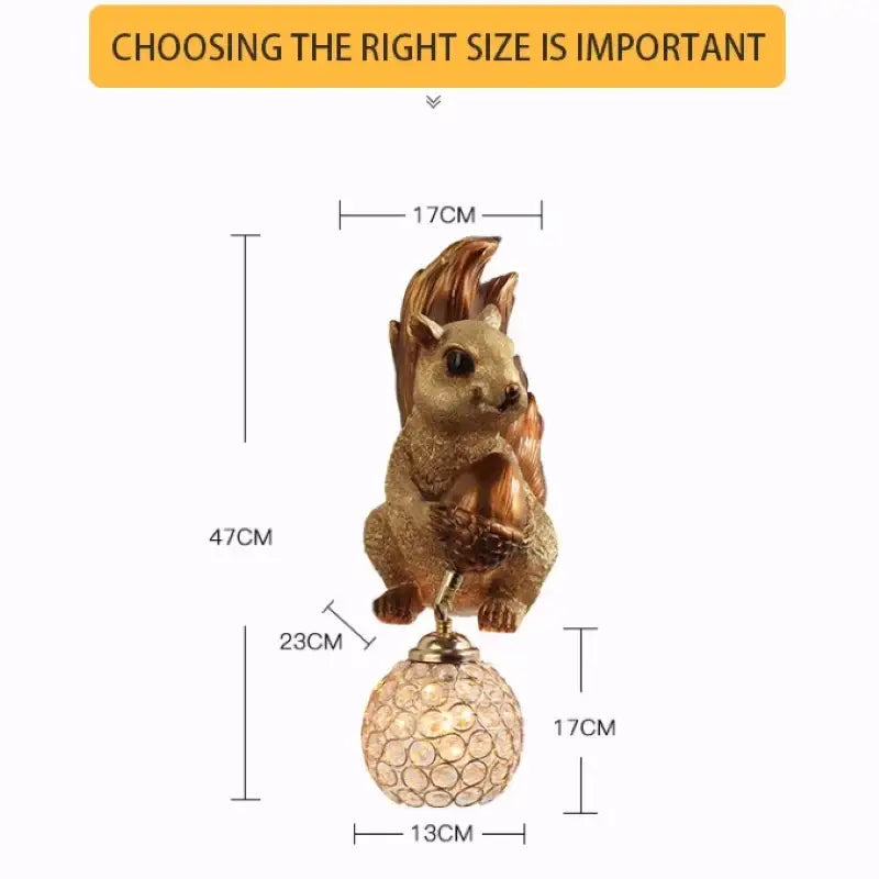 Golden resin cute squirrel wall lamp holding an acorn on a crystal globe base perfect for decorbites decor