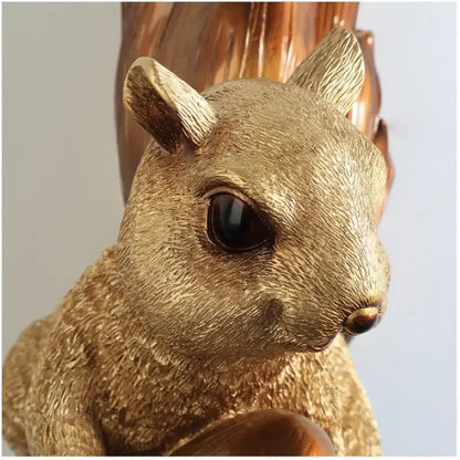 Golden resin cute squirrel wall lamp with detailed fur texture and dark glossy eyes for bedroom decorbites decor