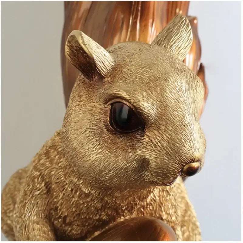 Golden resin cute squirrel wall lamp with detailed fur texture and dark glossy eyes for bedroom decorbites decor