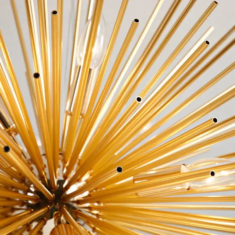 Golden starburst ball pendant lamp featuring a decorbites golden ball brass rod chandelier with clear glass bulbs