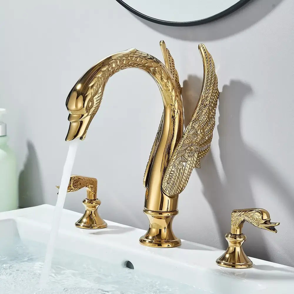 Golden swan dual handle deck mounted bathroom basin tap with cold water feature and intricate feather detailing