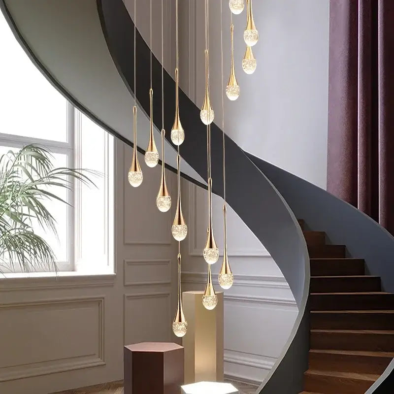 Golden teardrop pendant lights with crystal bubble ball accents hang elegantly for dining room decorbites decor