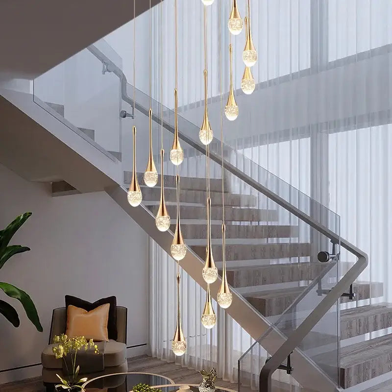 Elegant gold-toned pendant lights with crystal bubble ball accents in a modern cascading design for dining room decorbites crystal bubble