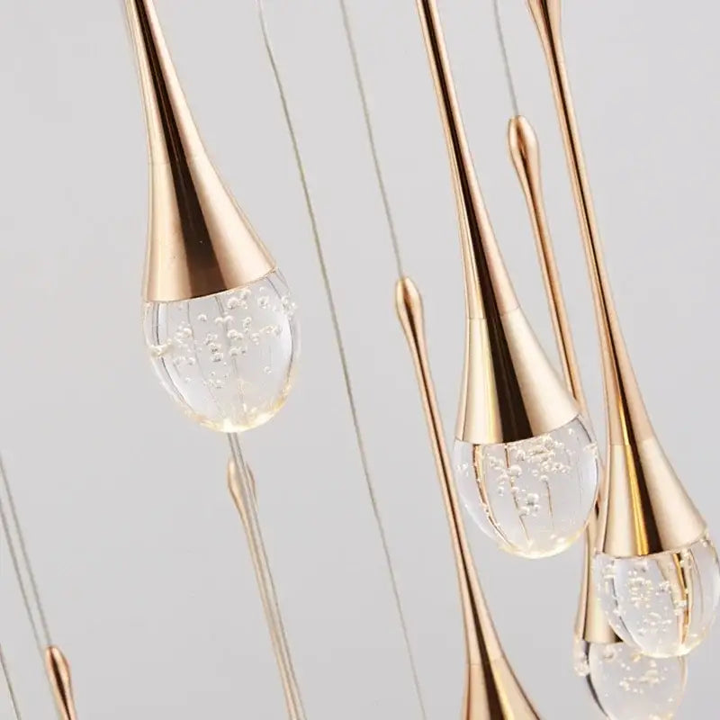 Golden teardrop pendant lights with clear glass crystal bubble ball globes perfect for dining room decorbites decor