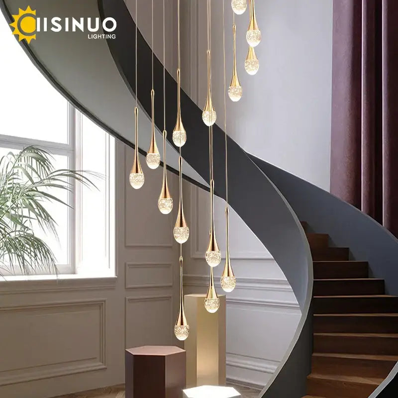 Golden teardrop crystal staircase chandelier with crystal accents by decorbites for elegant living room decorbites crystal staircase
