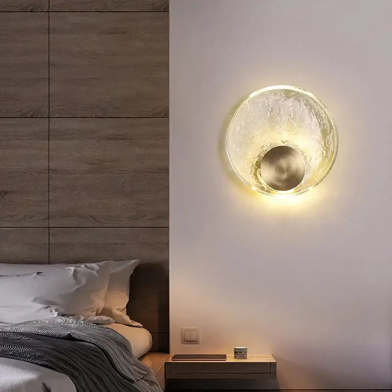 Circular golden textured elegance crystal wall lamp with frosted glass and metallic inner circle for bedroom or living room