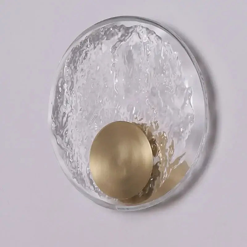Clear textured glass wall lamp with polished brass circular accent for elegance crystal wall lamp decor