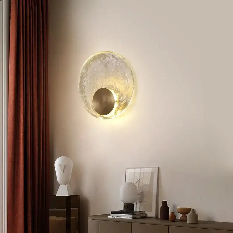 Golden textured elegance crystal wall lamp featuring a translucent textured glass sconce with a warm golden inner circle