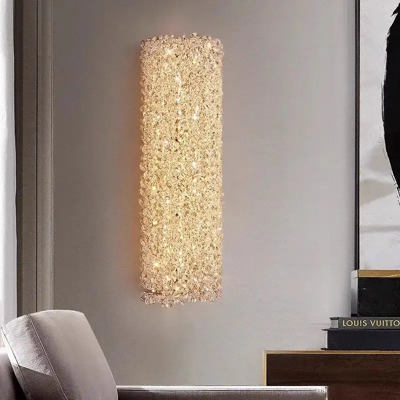 A tall golden textured glass wall lamp with decorbites crystal beads ideal for elegant living room decor