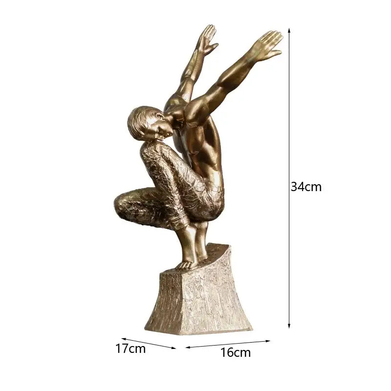 Bronze-colored resin sculpture of a golden thinker bodybuilder figurine in mid-motion on a textured office desk base