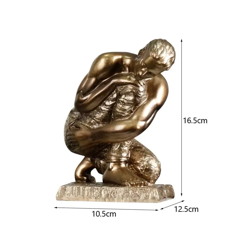 Bronze-colored resin sculpture of a crouching golden thinker bodybuilder with detailed musculature on stone base for office decor