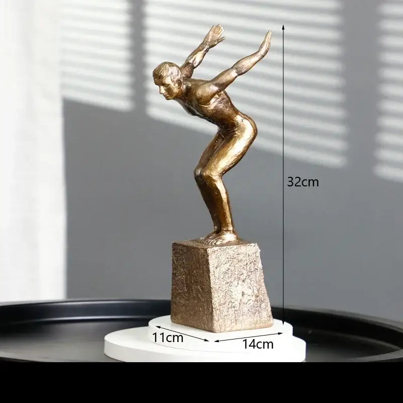 Bronze-colored resin sculpture of a golden thinker bodybuilder in mid-motion on a textured base for office decor