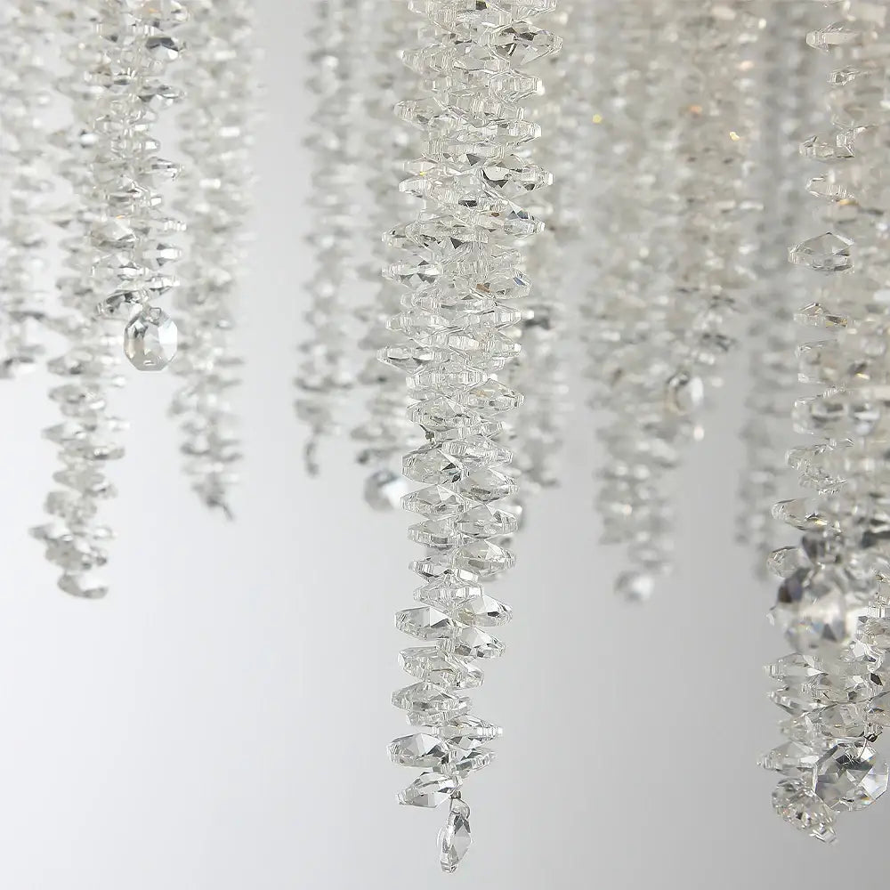 Clear faceted crystal beads in cascading strands on a golden tree branch crystal led ceiling chandelier decorbites branch crystal