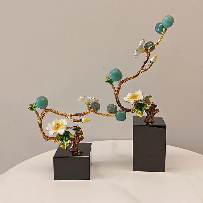 Elegant gold-toned ceramic golden tree plum sculpture with turquoise spheres white blossoms and green leaves for decor