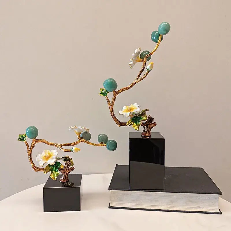 Elegant golden tree plum blossom porcelain sculpture with gold-toned branches, turquoise ornaments, and white blossoms