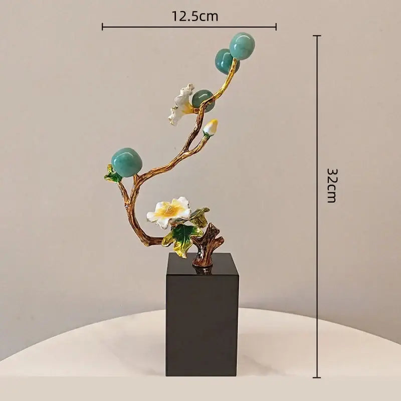 Golden tree plum blossom porcelain sculpture with turquoise orbs white blossoms and gold-leafed stems on black base