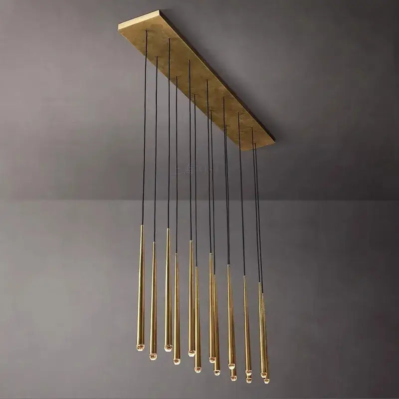 A modern brass water drop ceiling chandelier with crystal water drop pendants and black cords for living room decorbites crystal water