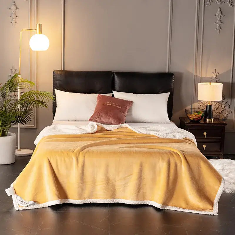 Golden and white double-layer velvet sofa blanket with soft plush texture and white fleece trim for bedroom use