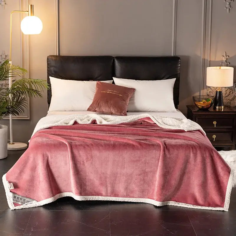 A plush pink fleece velvet sofa blanket with white sherpa trim double-layer velvet throw for bedroom use