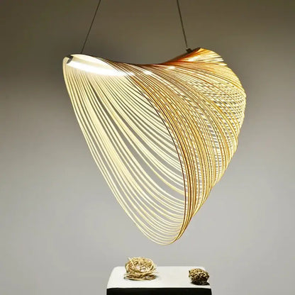 Golden wire mesh bamboo pendant light chandelier with flowing shell-like design made of thin interwoven metallic rods for decorbites bamboo pendant decor