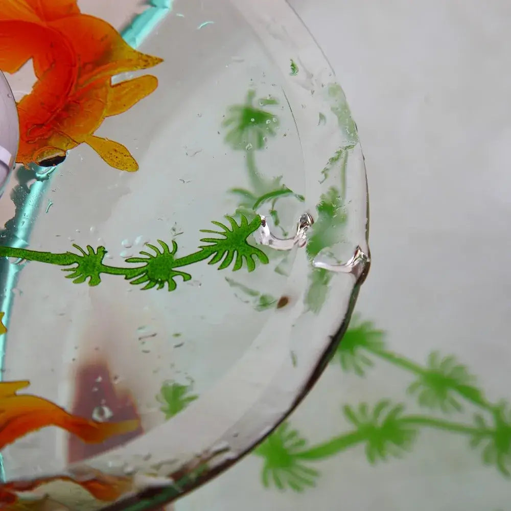 A decorbites goldfish glass waterfall faucet with vibrant orange and green floral decals and a glossy finish