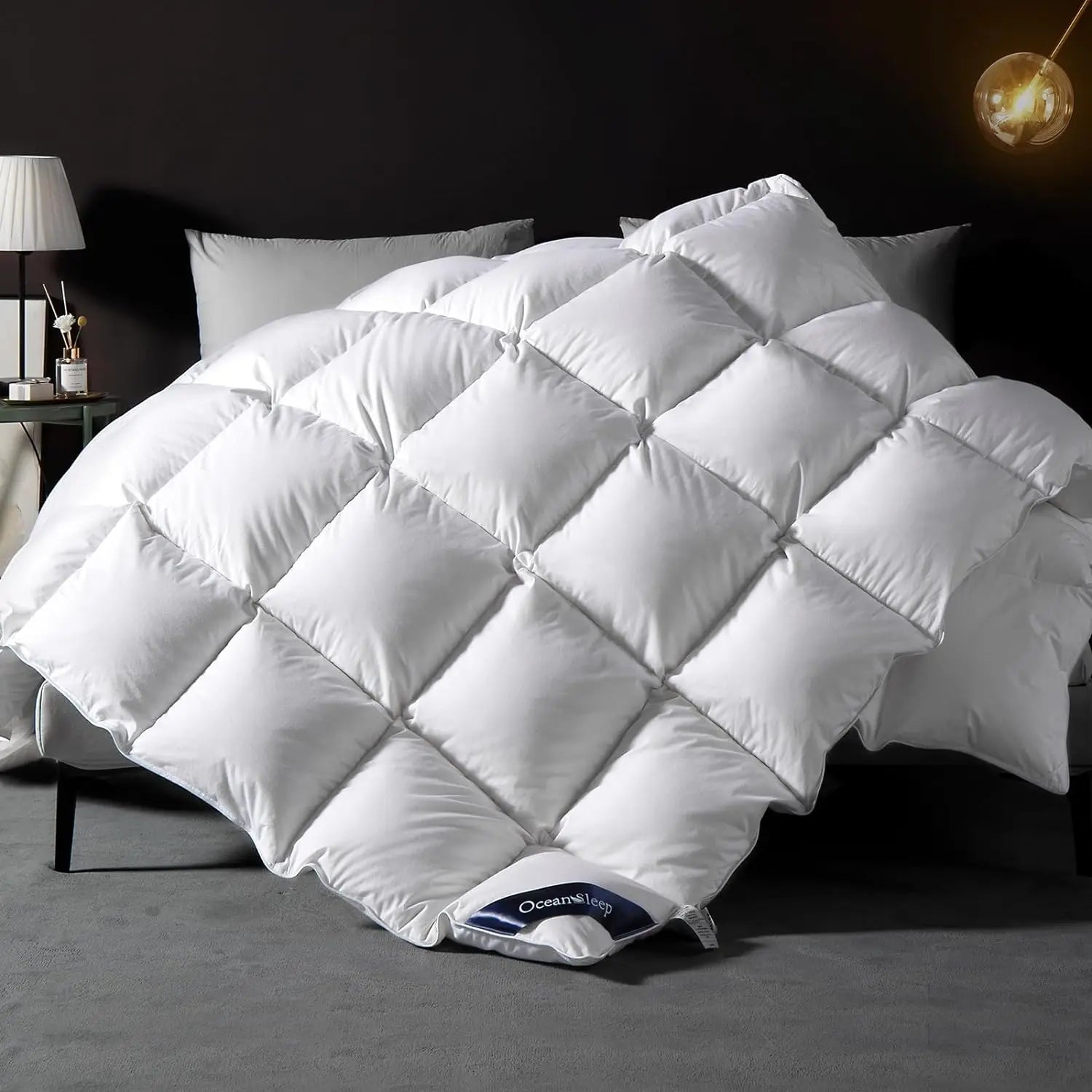 White quilted goose down comforter king queen size with diamond pattern and oceansleep branded tag for all season use