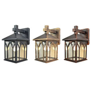 Three gothic arched glass led wall lamps with cross-topped roofs in black bronze and copper finishes for outdoor use
